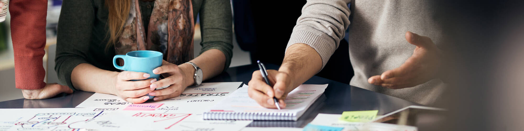 Happy Creative Team Writes Business Ideas While Brainstorming During Meeting Office.